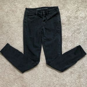 Artifacts of society stretch black skinny jeans